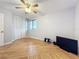 Bedroom featuring hardwood floors, a ceiling fan, and ample closet space at 421 Sheoah Blvd # 5, Winter Springs, FL 32708