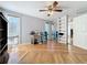 Bedroom with hardwood floors, mirrored closet, and ceiling fan at 421 Sheoah Blvd # 5, Winter Springs, FL 32708