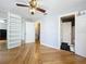 Bedroom with hardwood floors, mirrored closet and adjacent bathroom at 421 Sheoah Blvd # 5, Winter Springs, FL 32708