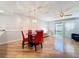 Bright dining area with hardwood floors and red chairs at 421 Sheoah Blvd # 5, Winter Springs, FL 32708