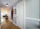 Hardwood floor entryway, white doors, and view into living room at 421 Sheoah Blvd # 5, Winter Springs, FL 32708