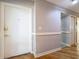 Bright entryway with hardwood floors and white doors at 421 Sheoah Blvd # 5, Winter Springs, FL 32708