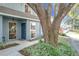 Townhome entrance with a large oak tree and walkway at 421 Sheoah Blvd # 5, Winter Springs, FL 32708
