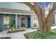 Neat townhome with covered entryway, landscaping, and a large oak tree at 421 Sheoah Blvd # 5, Winter Springs, FL 32708