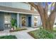 Light blue townhome with covered entry and mature landscaping at 421 Sheoah Blvd # 5, Winter Springs, FL 32708