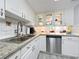 Modern kitchen with granite countertops and stainless steel appliances at 421 Sheoah Blvd # 5, Winter Springs, FL 32708