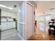 White kitchen cabinets, granite countertops, and tile floors at 421 Sheoah Blvd # 5, Winter Springs, FL 32708