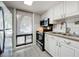 Updated kitchen featuring stainless steel appliances and white cabinetry at 421 Sheoah Blvd # 5, Winter Springs, FL 32708