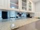 Updated kitchen featuring stainless steel appliances and white cabinets at 421 Sheoah Blvd # 5, Winter Springs, FL 32708