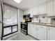 Modern kitchen with stainless steel appliances and white cabinets at 421 Sheoah Blvd # 5, Winter Springs, FL 32708