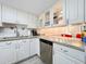 Bright kitchen with white cabinets, granite counters, and stainless steel appliances at 421 Sheoah Blvd # 5, Winter Springs, FL 32708