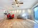 Bright living area with hardwood floors, a couch, and a dining area at 421 Sheoah Blvd # 5, Winter Springs, FL 32708