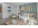 Bright living room with comfy sectional sofa and coastal decor at 4225 Singing Mockingbird Blvd, Bartow, FL 33830