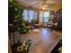 Living room with wood-look floors, two armchairs, and a ceiling fan at 4420 Lake Lawne Ave, Orlando, FL 32808