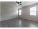 Simple bedroom with grey tile flooring and ceiling fan at 4617 Harvest Row Ln, St Cloud, FL 34772