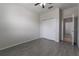 Bedroom with double door closet and grey tile flooring at 4617 Harvest Row Ln, St Cloud, FL 34772