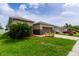 Side view of the house showing additional landscaping and driveway at 4617 Harvest Row Ln, St Cloud, FL 34772