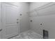 Laundry room with built-in shelving at 4617 Harvest Row Ln, St Cloud, FL 34772