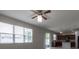 Living room with sliding door access to the backyard and kitchen at 4617 Harvest Row Ln, St Cloud, FL 34772