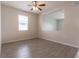 Living room with grey tile floor and a ceiling fan at 4617 Harvest Row Ln, St Cloud, FL 34772