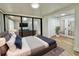 Spacious bedroom with mirrored closet doors and access to the living room at 473 Oak Haven Dr # 473, Altamonte Springs, FL 32701