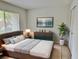 Bedroom with a dresser, large window and neutral color palette at 473 Oak Haven Dr # 473, Altamonte Springs, FL 32701