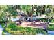 Outdoor patio area with tables, chairs, and greenery, perfect for entertaining and relaxing at 473 Oak Haven Dr # 473, Altamonte Springs, FL 32701