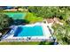 Aerial view of a large community pool, tennis court and surrounding landscaping at 473 Oak Haven Dr # 473, Altamonte Springs, FL 32701