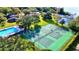 Aerial view of the community pool, tennis courts, and lake access for recreation and leisure at 473 Oak Haven Dr # 473, Altamonte Springs, FL 32701