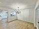 Spacious dining room with hardwood floors and a modern chandelier at 473 Oak Haven Dr # 473, Altamonte Springs, FL 32701
