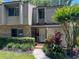 Charming townhouse with a well-manicured front yard, brick accents, and a welcoming entryway at 473 Oak Haven Dr # 473, Altamonte Springs, FL 32701