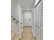 Bright hallway with light wood-look floors and white walls at 473 Oak Haven Dr # 473, Altamonte Springs, FL 32701