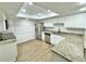 Bright kitchen with granite countertops, stainless steel appliances, and stylish white cabinets at 473 Oak Haven Dr # 473, Altamonte Springs, FL 32701