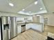 Bright kitchen with white cabinets, granite counters, and stainless steel appliances at 473 Oak Haven Dr # 473, Altamonte Springs, FL 32701