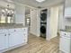 Kitchen area with new countertops, a stackable washer and dryer, and wood-look flooring at 473 Oak Haven Dr # 473, Altamonte Springs, FL 32701