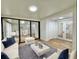 Living room with white sofa and wood-look floors at 473 Oak Haven Dr # 473, Altamonte Springs, FL 32701