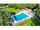 Community pool with surrounding lawn and lounge chairs at 473 Oak Haven Dr # 473, Altamonte Springs, FL 32701