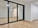Sunroom with mirrored sliding doors and wood-look floors at 473 Oak Haven Dr # 473, Altamonte Springs, FL 32701