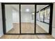Sunroom with mirrored sliding doors and wood-look floors at 473 Oak Haven Dr # 473, Altamonte Springs, FL 32701