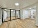 Sunroom with mirrored sliding doors and wood-look floors at 473 Oak Haven Dr # 473, Altamonte Springs, FL 32701