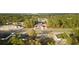New homes from an aerial view are surrounded by lush greenery and a modern design at 709 Marion Oaks Mnr, Ocala, FL 34473