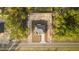 A bird's-eye view of the house with a well-maintained yard and a paved driveway at 709 Marion Oaks Mnr, Ocala, FL 34473