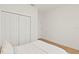 Simple bedroom featuring ample closet space, light wood floors, and neutral tones for a serene atmosphere at 709 Marion Oaks Mnr, Ocala, FL 34473