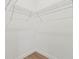 An empty closet featuring wire shelving, neutral walls, and wood floors at 709 Marion Oaks Mnr, Ocala, FL 34473