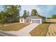 Charming one-story home with a well-manicured lawn and an attached two-car garage at 709 Marion Oaks Mnr, Ocala, FL 34473