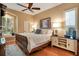 Serene main bedroom with hardwood floors, a window seat, and ample natural light at 711 Ironwood Ct, Winter Springs, FL 32708