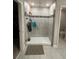 Bathroom with large walk-in shower and tiled flooring at 7835 Syracuse Dr, Clermont, FL 34714