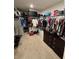 Large walk-in closet with ample shelving and drawer space at 7835 Syracuse Dr, Clermont, FL 34714