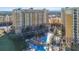 Aerial view showing resort buildings and a pirate ship themed pool at 8101 Resort Village Dr, Orlando, FL 32821
