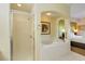 Large bathroom with shower and a separate bathtub at 8101 Resort Village Dr, Orlando, FL 32821